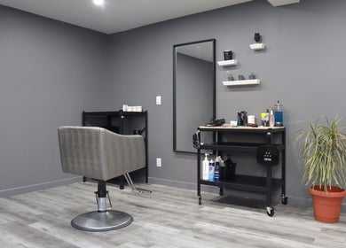 Modern hair salon chair and tools at The Spot, Montréal, Québec, CA offering a stylish ambience for beauty treatments.