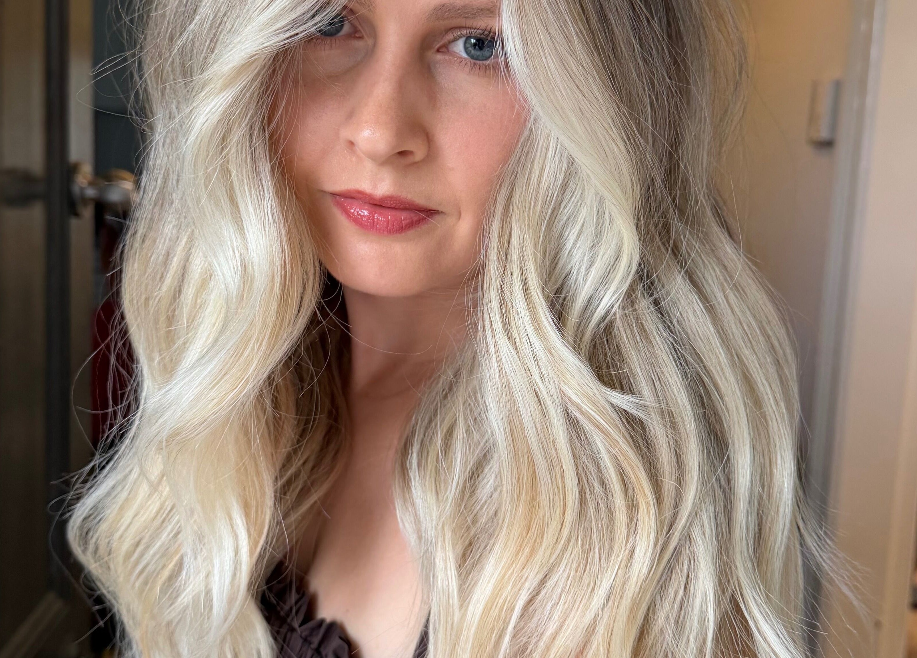 Blonde hair styled in elegant waves at Hair by Bree, Camden, New South Wales, AU.