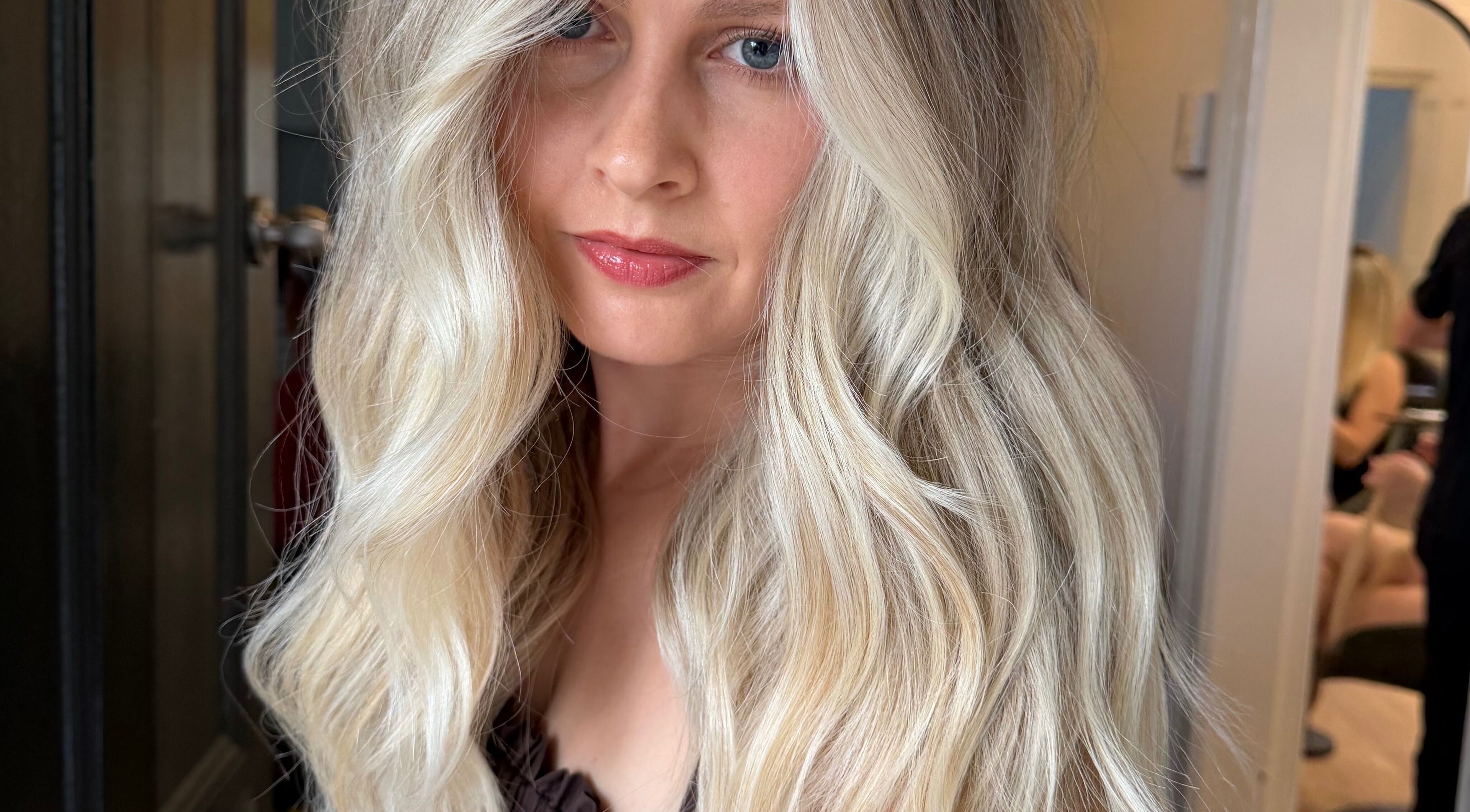 Blonde hair styled in elegant waves at Hair by Bree, Camden, New South Wales, AU.