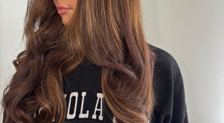 Voluminous brown hair extensions styled at GMR Extensions, Northampton, England, GB.