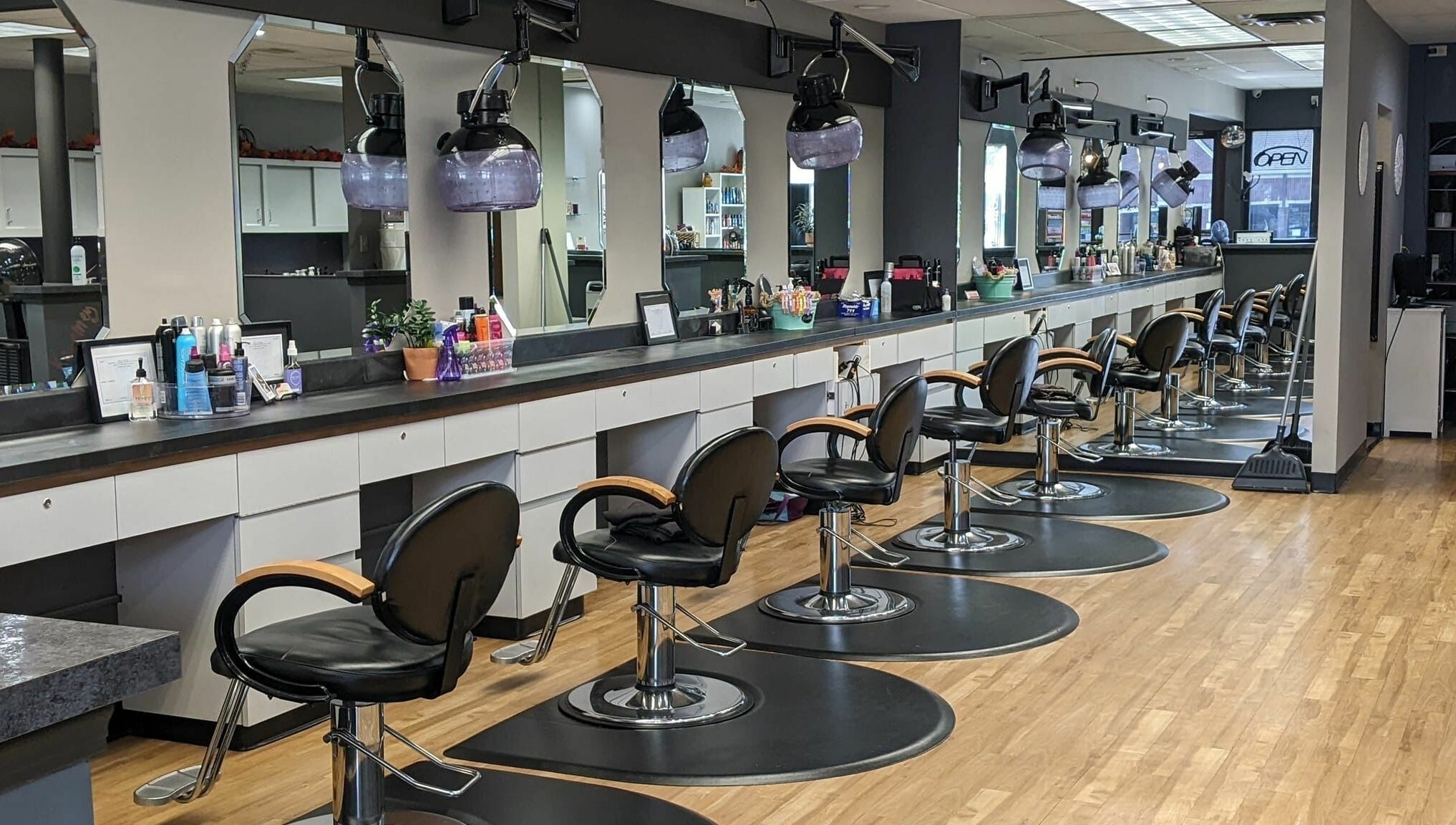 Stylish interior of Changes Hair Design in Meridian Charter Township, Michigan, US, featuring sleek salon chairs.