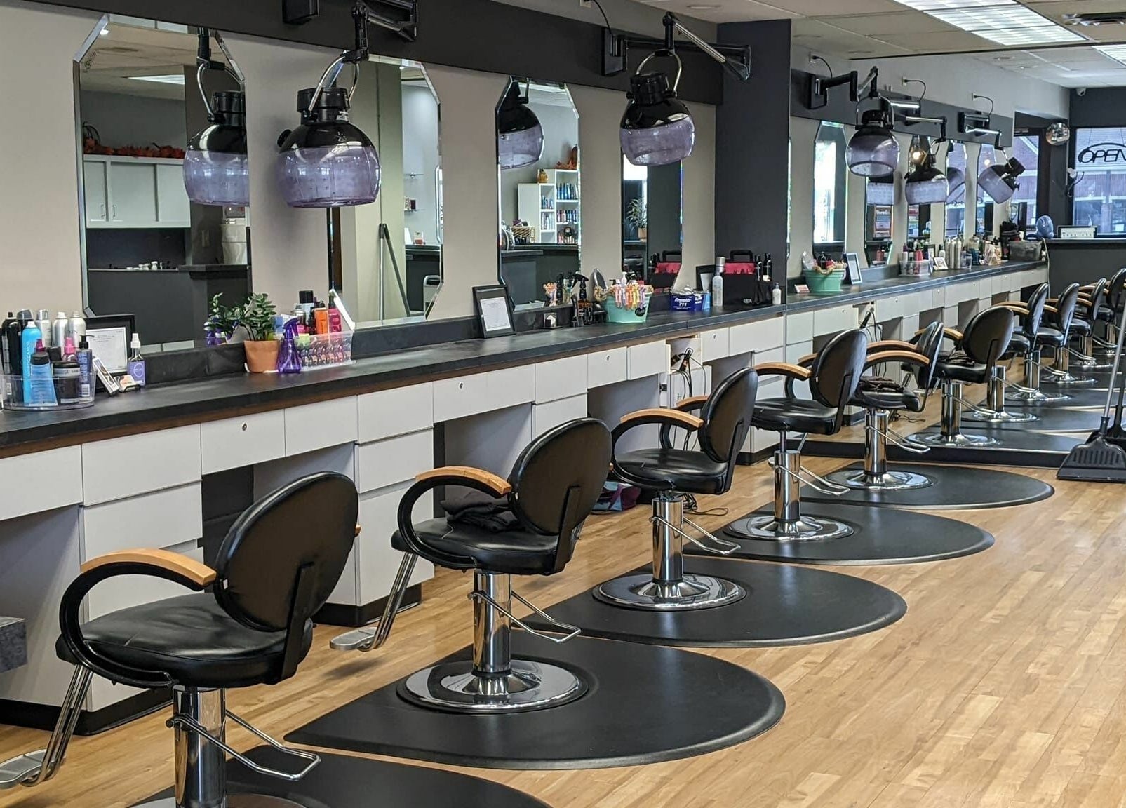 Stylish interior of Changes Hair Design in Meridian Charter Township, Michigan, US, featuring sleek salon chairs.