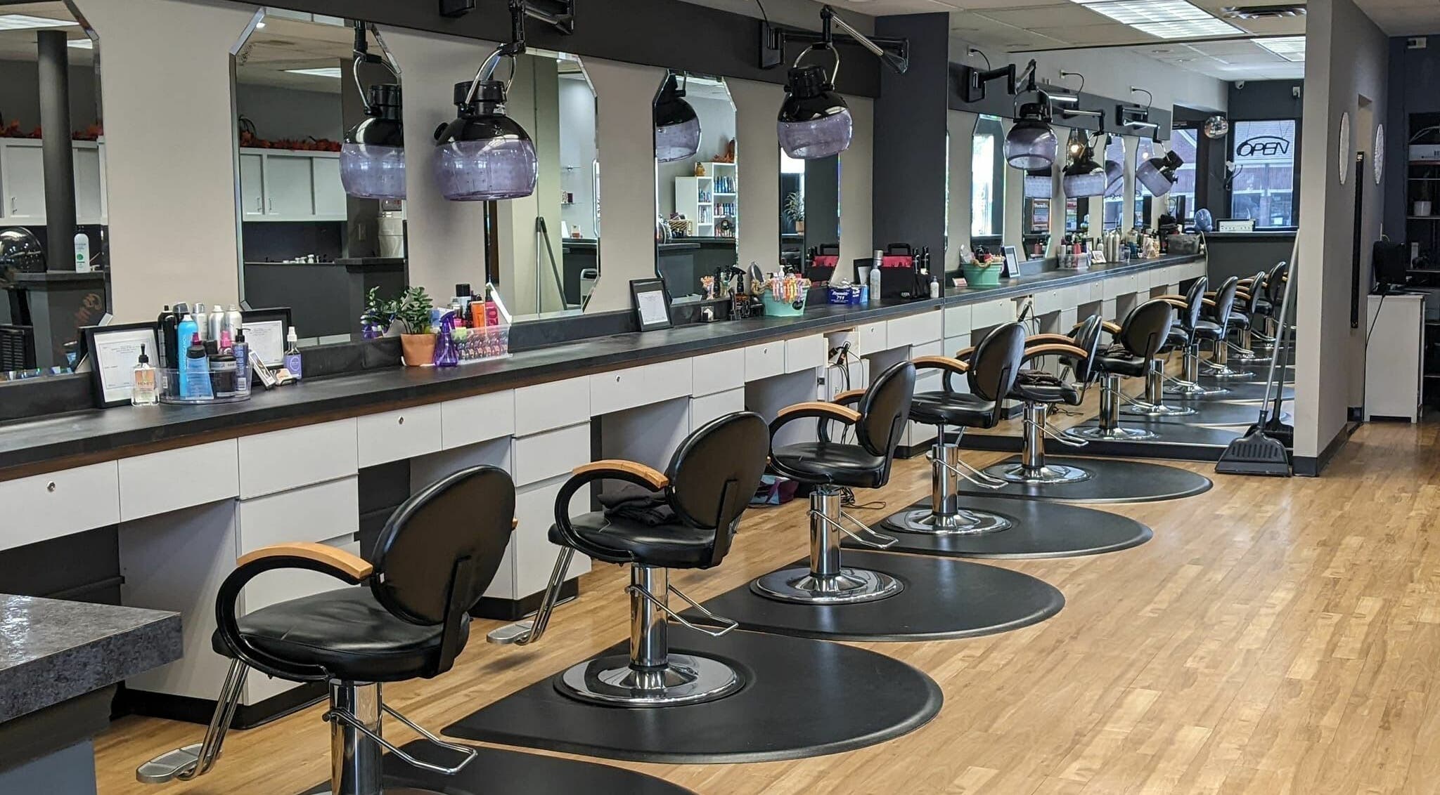 Stylish interior of Changes Hair Design in Meridian Charter Township, Michigan, US, featuring sleek salon chairs.