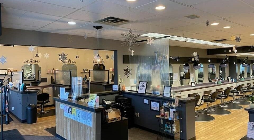 Interior of Changes Hair Design in Meridian Charter Township, Michigan, US, showcasing modern salon stations.