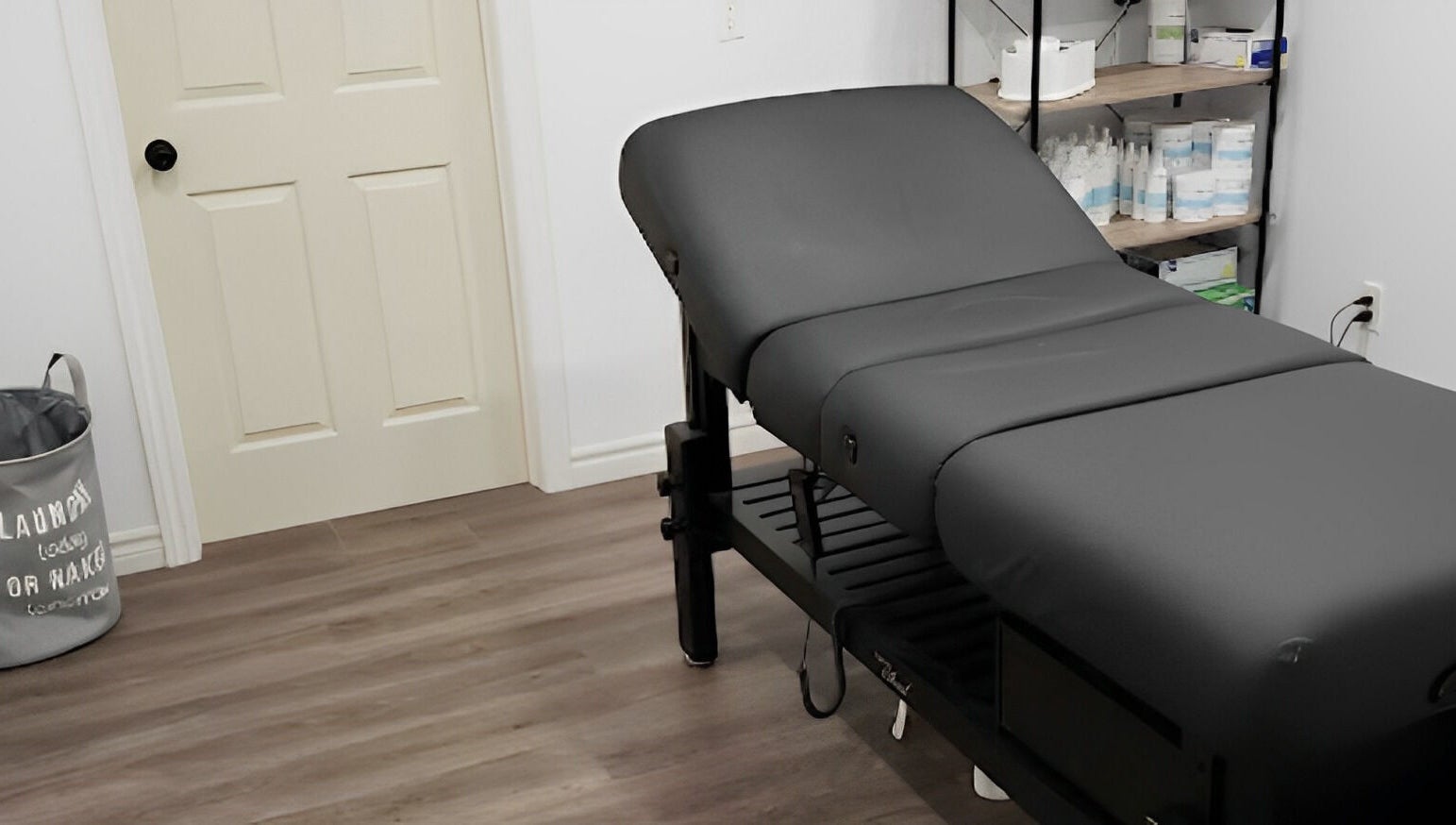 Relaxing treatment room at The Sugary, Peterborough, Ontario, CA, featuring a comfy massage table.