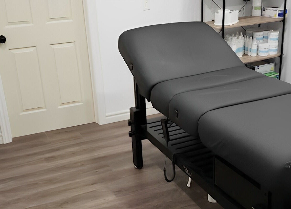 Relaxing treatment room at The Sugary, Peterborough, Ontario, CA, featuring a comfy massage table.