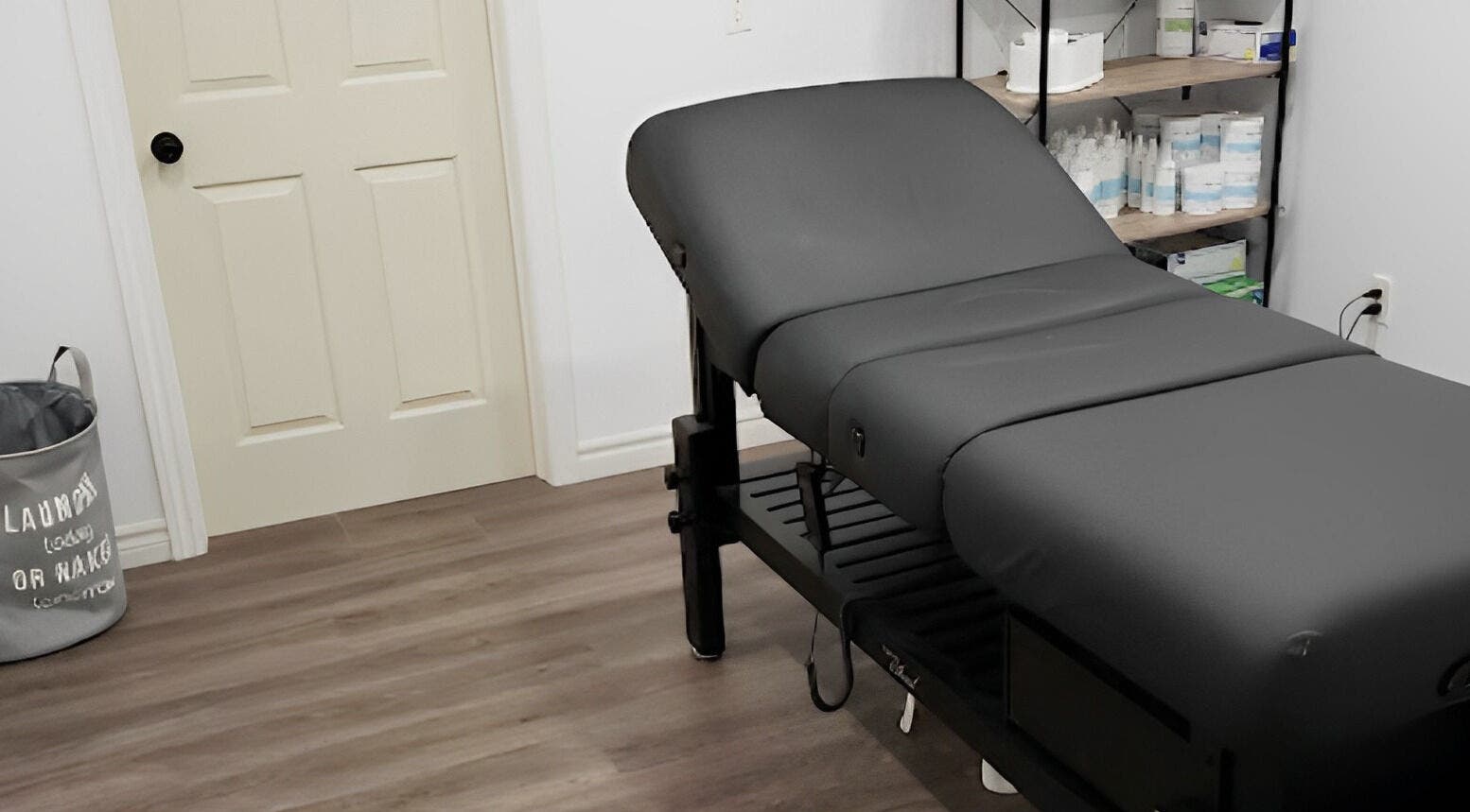 Relaxing treatment room at The Sugary, Peterborough, Ontario, CA, featuring a comfy massage table.