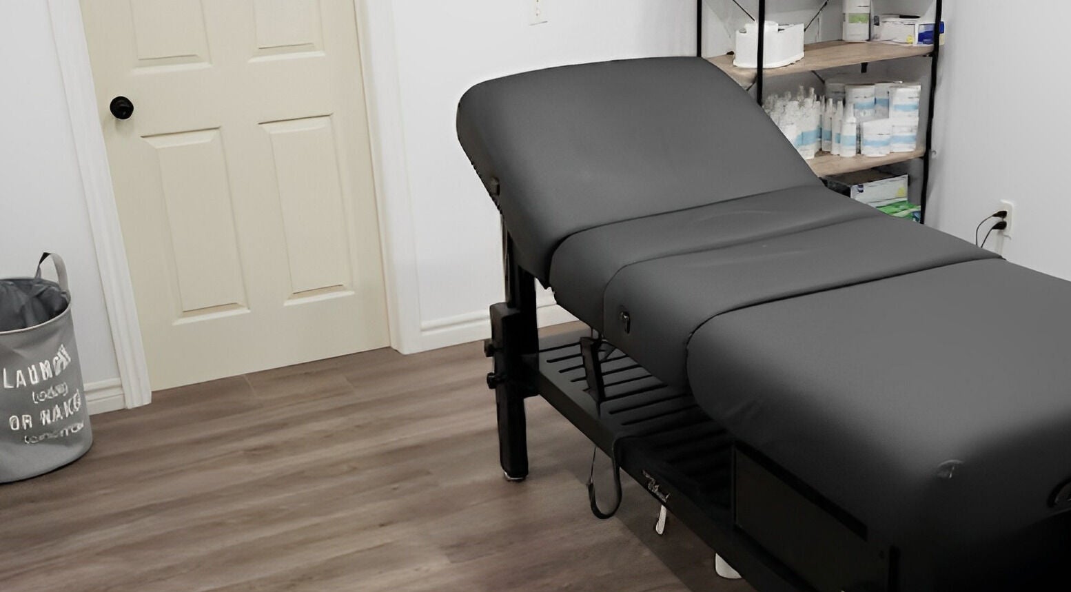 Relaxing treatment room at The Sugary, Peterborough, Ontario, CA, featuring a comfy massage table.