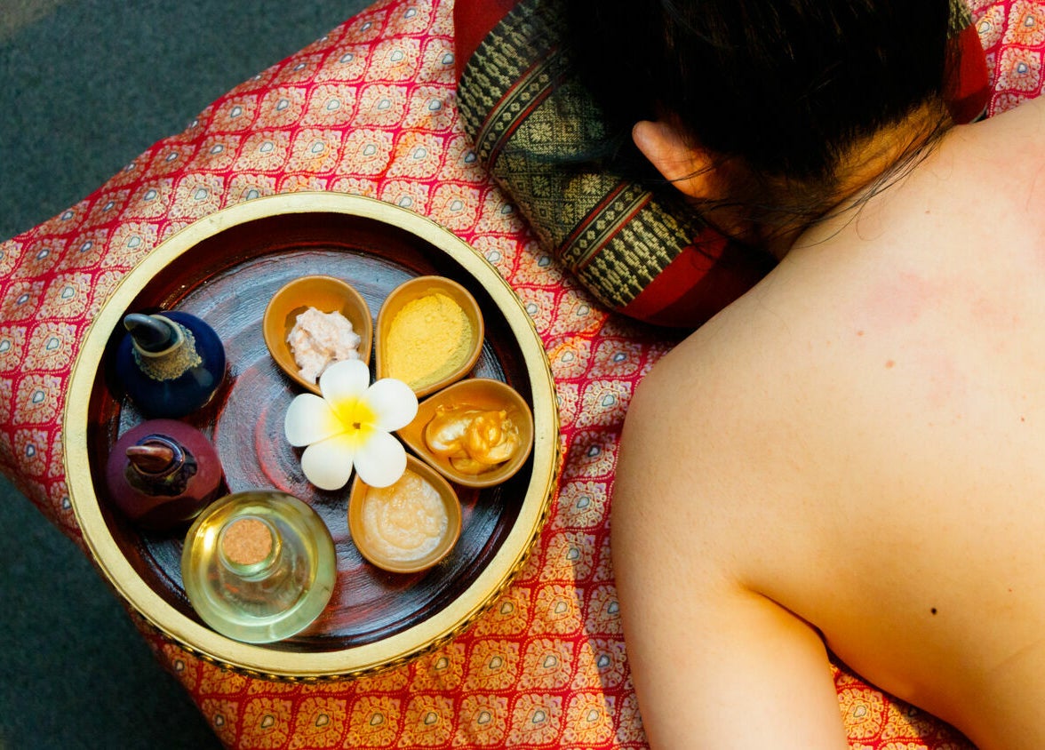 Relaxing spa treatment at Thai Villa Spa, Newton, Massachusetts, US, with oils and a serene atmosphere.