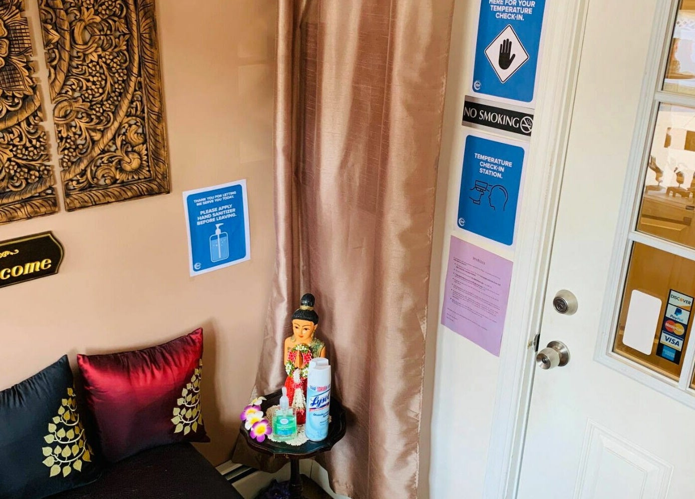 Entrance of Thai Villa Spa in Newton, Massachusetts, showcasing a warm and inviting decor.