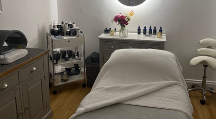 Relaxing treatment room at The Norfolk Beauty Rooms, North Walsham, England, GB, featuring cozy bed and products.