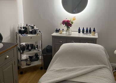 Relaxing treatment room at The Norfolk Beauty Rooms, North Walsham, England, GB with cozy decor and spa products.