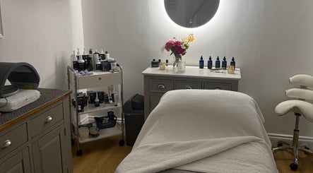 Relaxing treatment room at The Norfolk Beauty Rooms, North Walsham, England, GB with cozy decor and spa products.