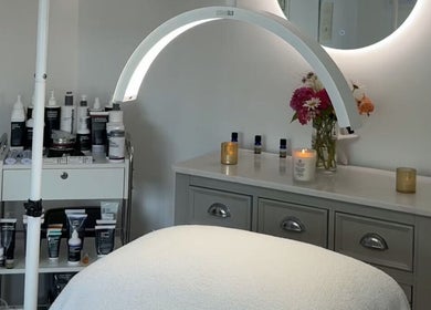 A tranquil treatment room at The Norfolk Beauty Rooms, North Walsham, England, GB, with candles and skincare products.