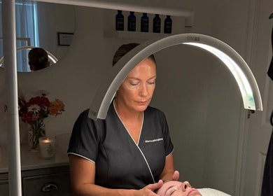 Therapist performing a facial treatment at The Norfolk Beauty Rooms, North Walsham, England, GB.