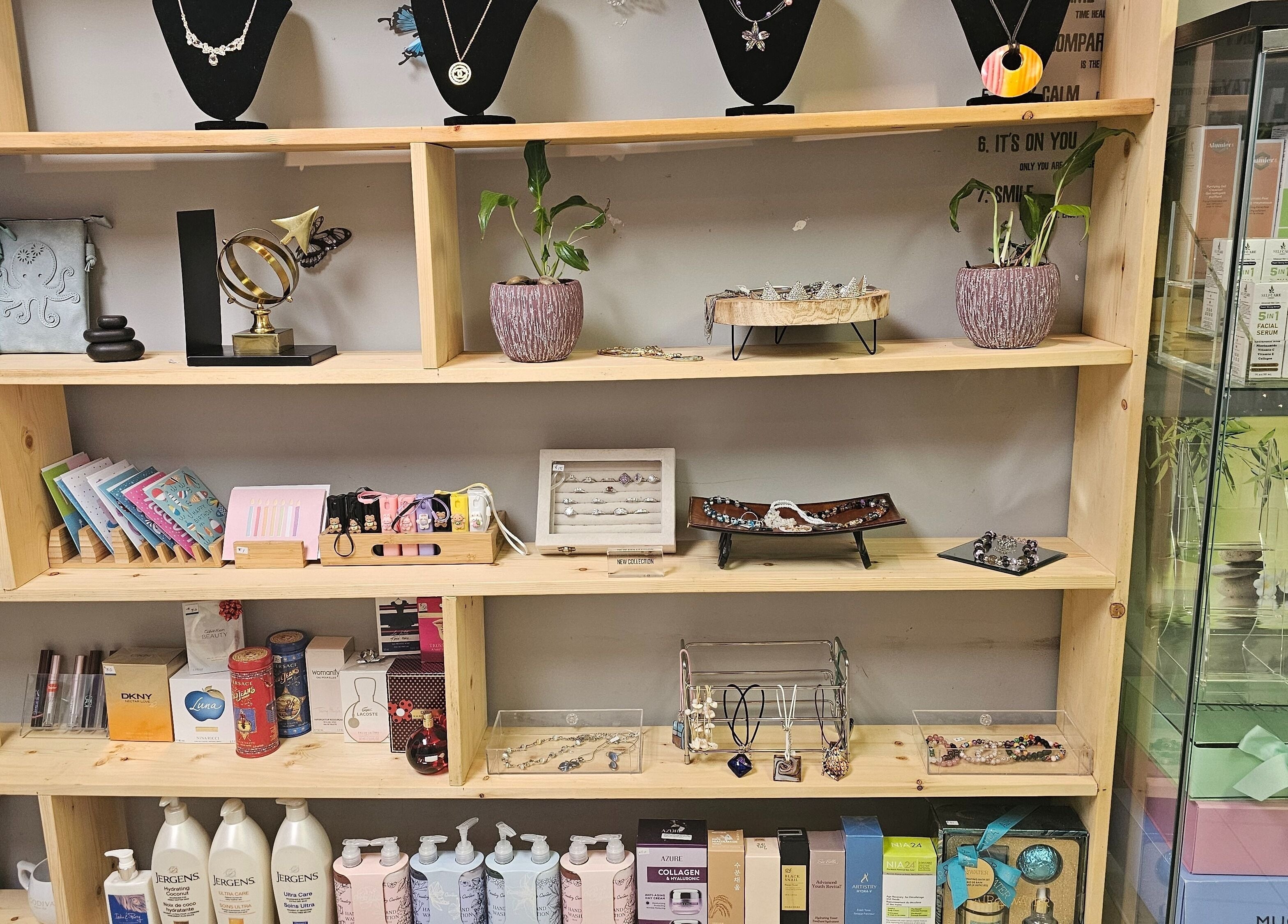HoangLinh Spa's product display, Mission, British Columbia, CA showcasing jewelry and skincare.