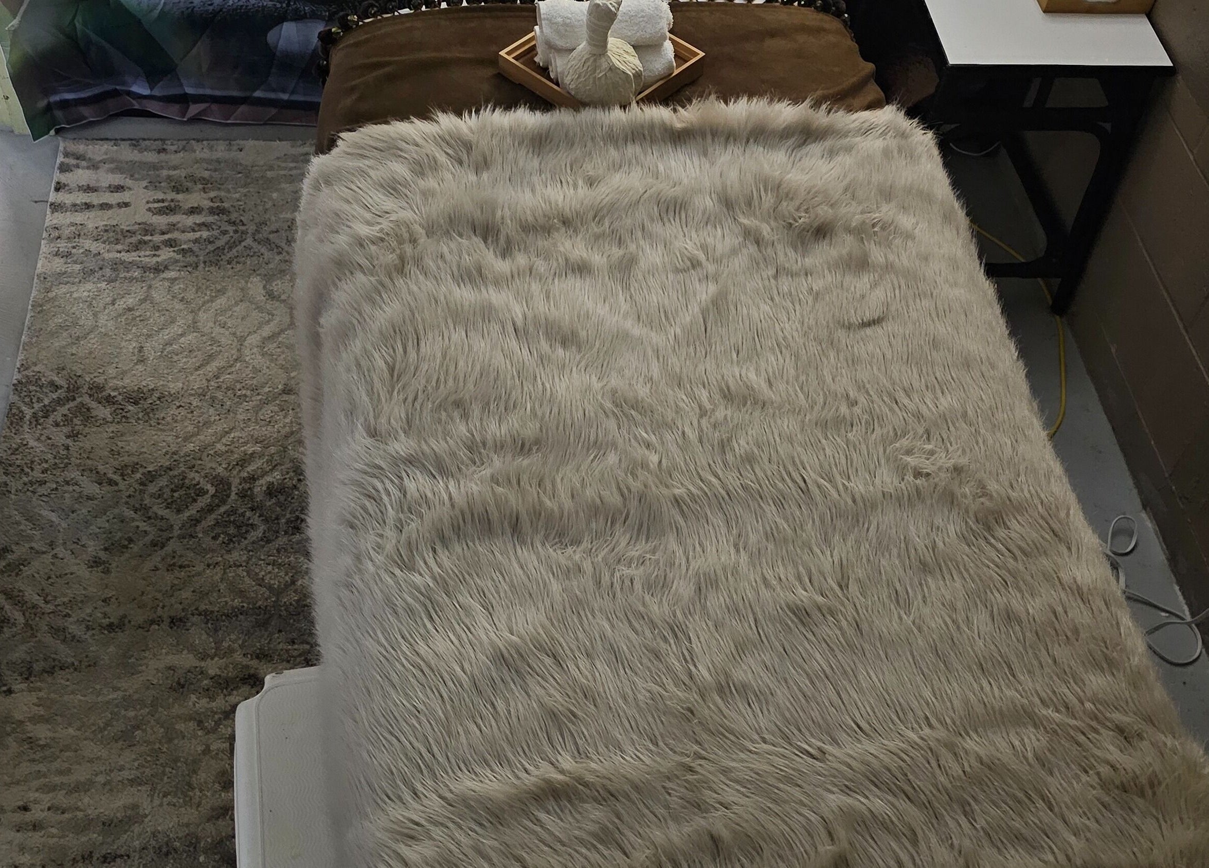 Relaxation bed at HoangLinh Spa with plush brown blanket in Mission, British Columbia, CA.