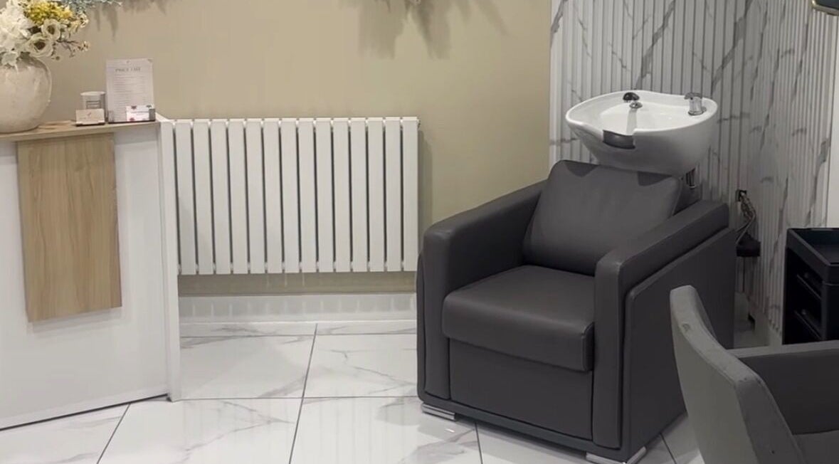 Elegant salon wash station at Genesis Skin & Beauty in Barrow, England, GB, offering luxury hair treatments.