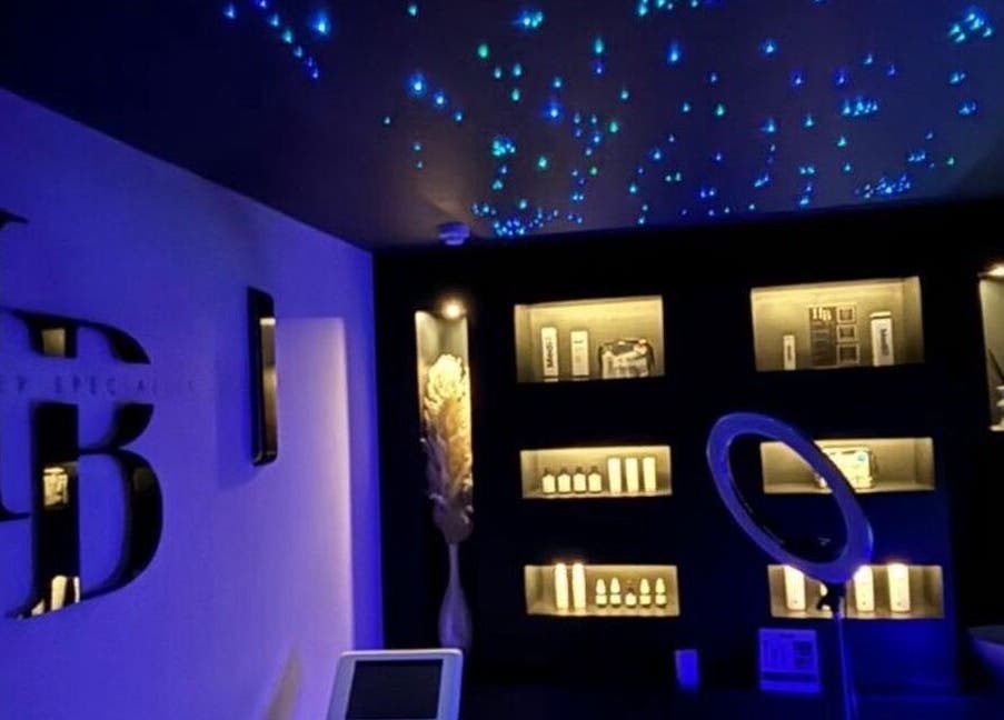 Genesis Skin & Beauty's starry-lit room in Barrow, England, GB with elegant shelving and beauty products.
