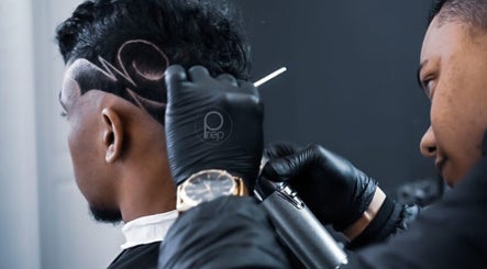 Intricate haircut design at Prep Beauty Lounge, Paarl, Western Cape, ZA, showcasing skilled barber art.