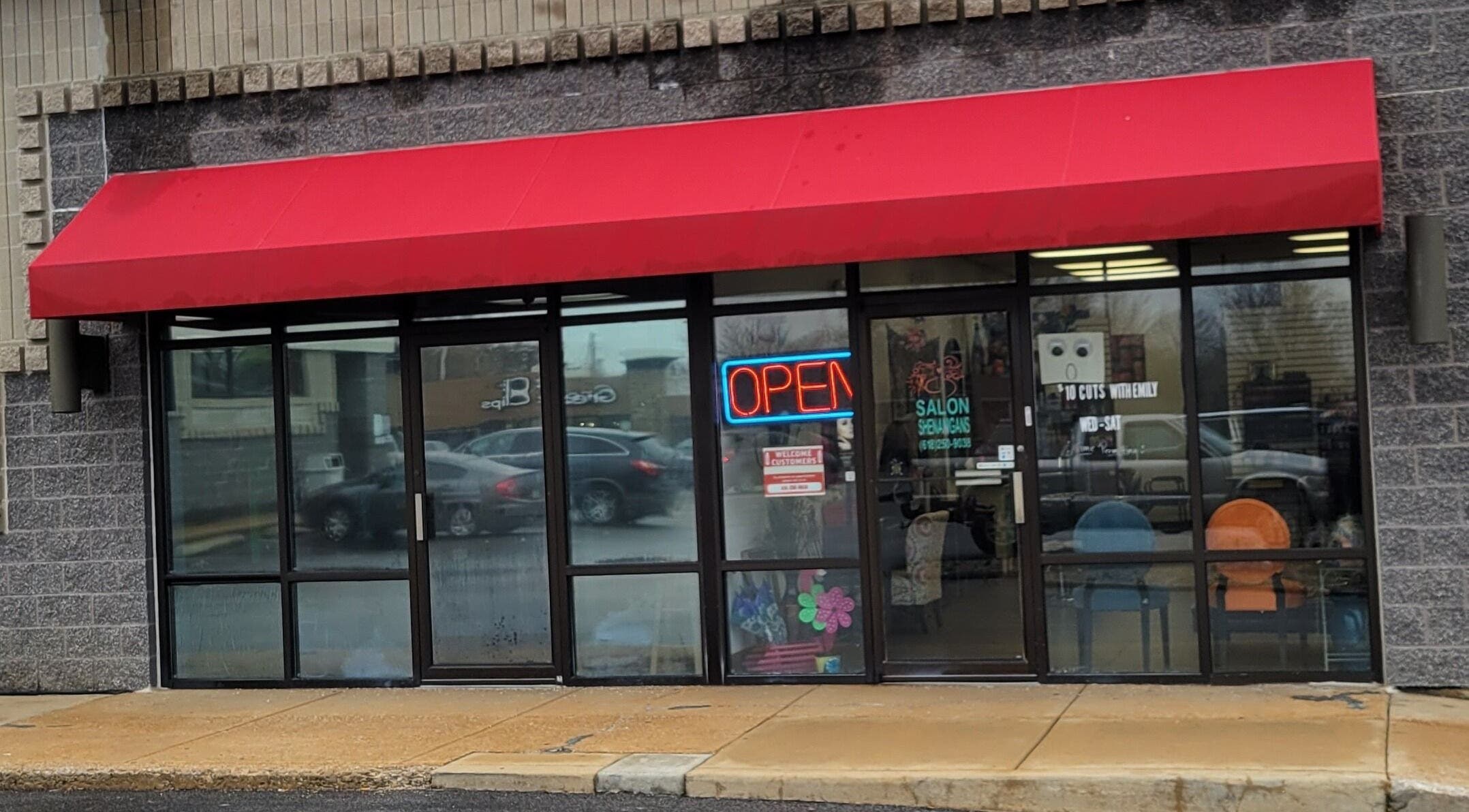 Front view of Salon Shenanigans LLC with red awning in St. Louis, Missouri, US.