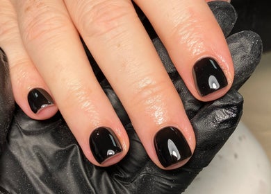 Elegant black manicure at Rebecca Davies Beauty, Kenfig Hill, Wales, GB, showcasing precision and style.