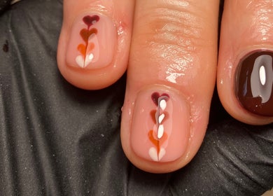Stylish nail art at Rebecca Davies Beauty, Kenfig Hill, Wales, GB showcasing intricate design.