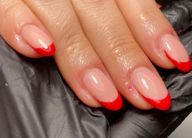 Elegant red-tipped nails at Rebecca Davies Beauty | CASH ONLY | in Kenfig Hill, Wales, GB.
