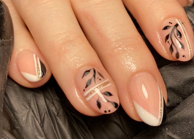 Elegant nail art at Rebecca Davies Beauty | CASH ONLY | in Kenfig Hill, Wales, GB. Featuring black leaf designs.