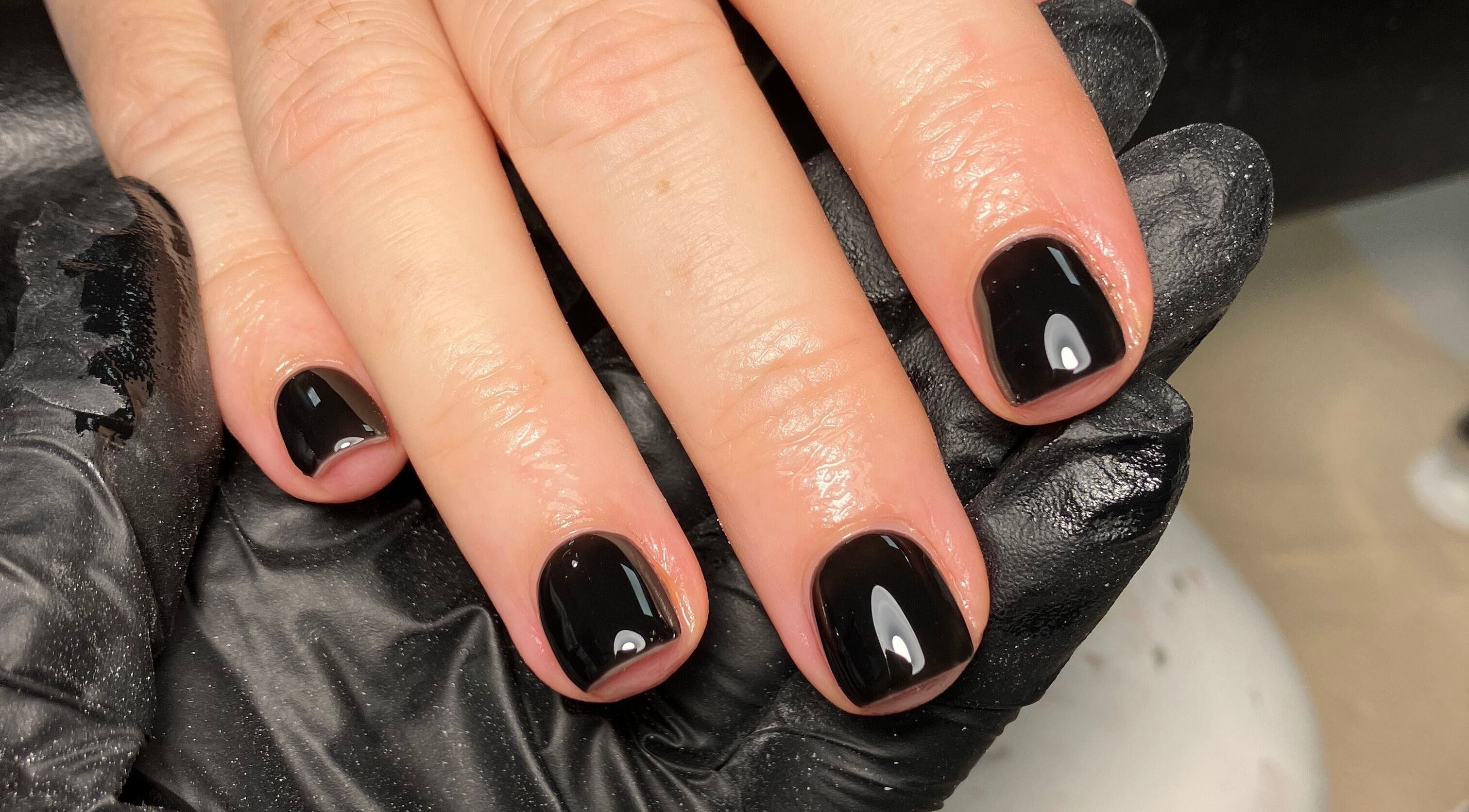 Sleek black manicure at Rebecca Davies Beauty | CASH ONLY | in Kenfig Hill, Wales, GB.