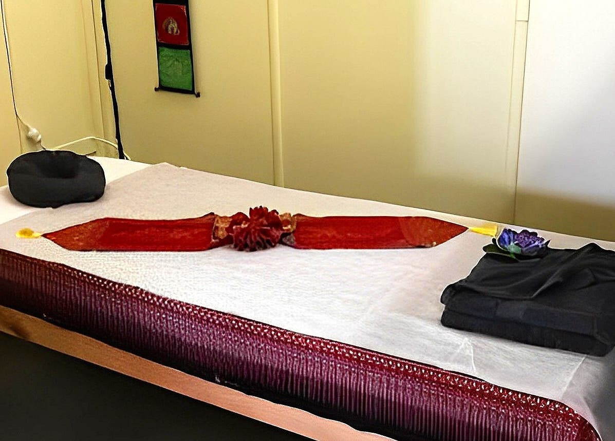 Relaxing massage room at Lotus Thai Massage Warwick, QLD, featuring a decorated massage table. Warwick, Queensland, AU.
