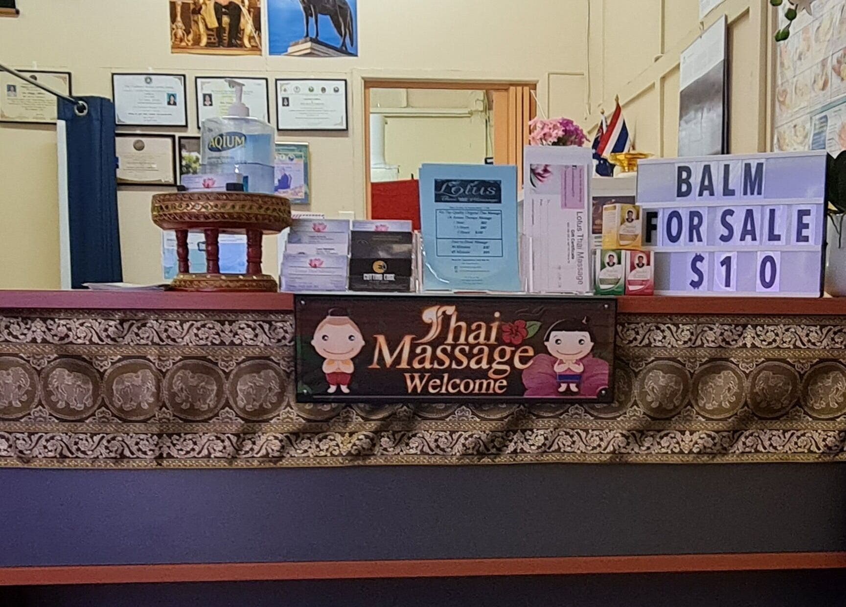 Welcome desk at Lotus Thai Massage Warwick, QLD, displaying balm sale sign, in Warwick, Queensland, AU.