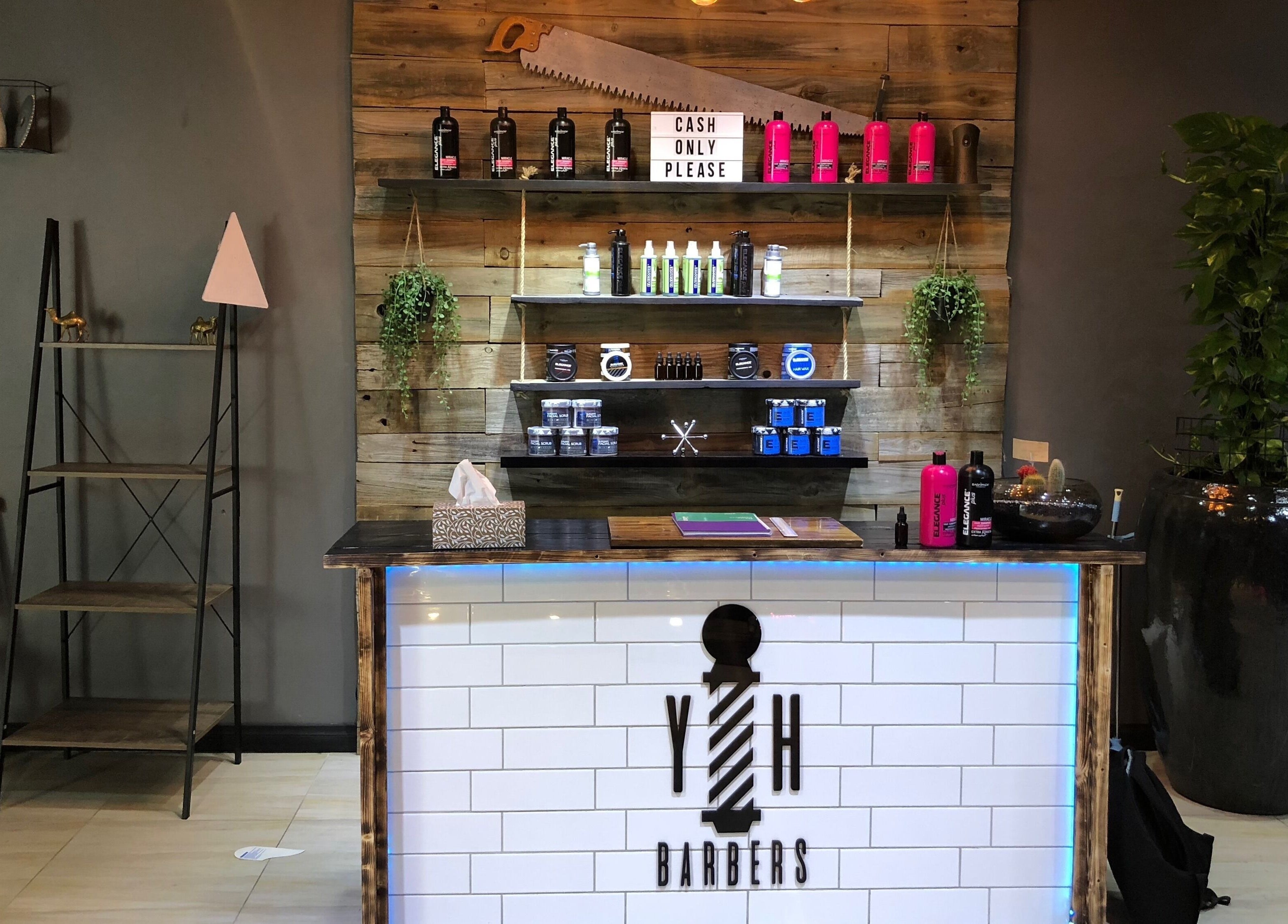 Reception area of Young Habbitt Barbers - Werribee in Melbourne, Victoria, AU with stylish decor and products.