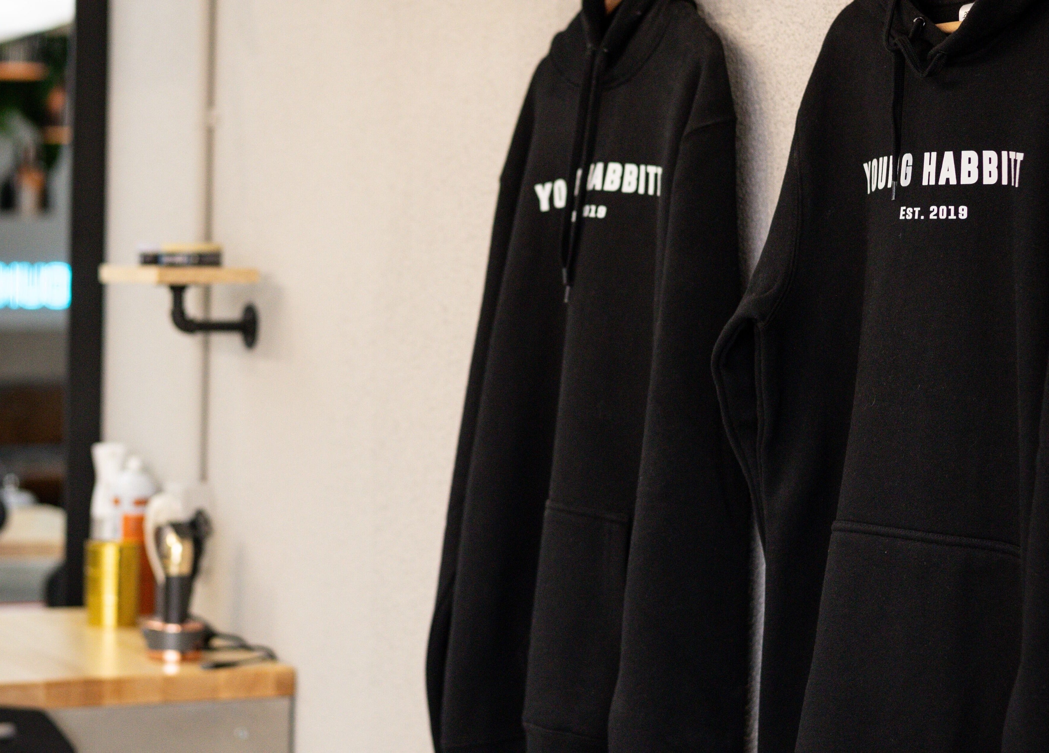 Young Habbitt Barbers - Werribee showcases stylish black hoodies in Melbourne, Victoria, AU.