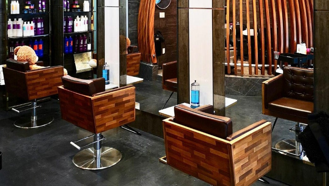 Stylish wooden salon chairs and mirrors at Vsalon in Vancouver, British Columbia, CA.