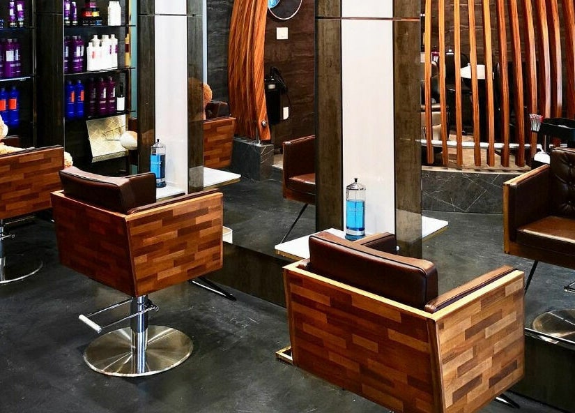 Stylish wooden salon chairs and mirrors at Vsalon in Vancouver, British Columbia, CA.