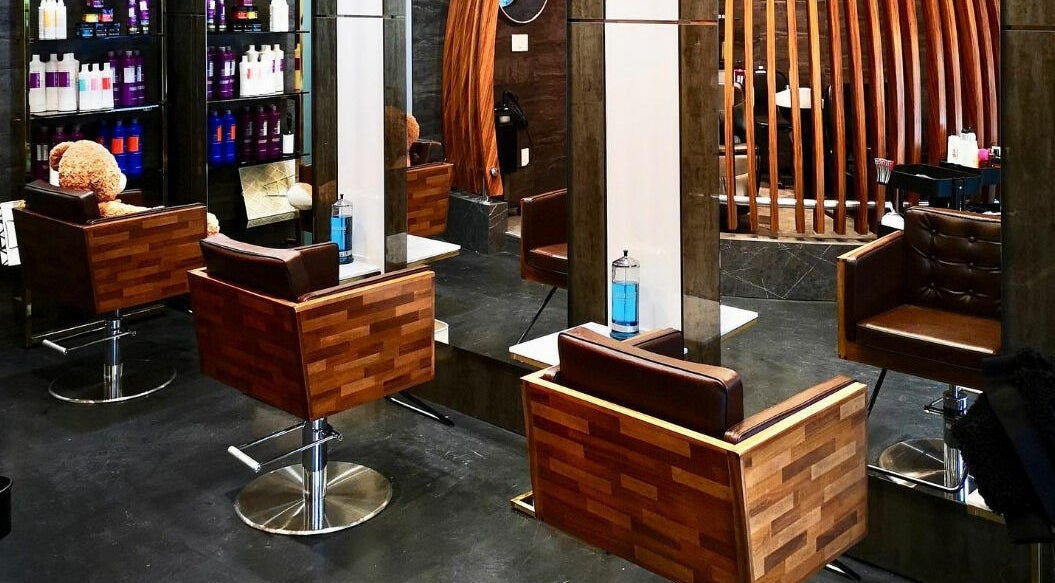 Stylish wooden salon chairs and mirrors at Vsalon in Vancouver, British Columbia, CA.