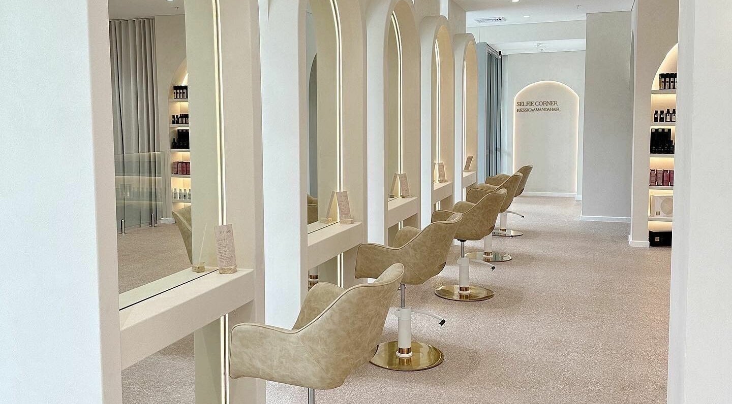 Elegant interior of Jessica Amanda Hair in Perth, Western Australia, AU with stylish salon chairs and mirrors.