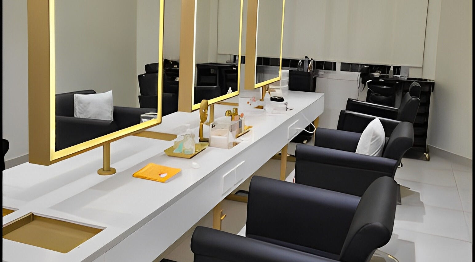 Modern interior of The Muse Salon in Manama, Muḥāfaẓat al-ʿĀṣimah, BH with stylish salon chairs and elegant mirrors.