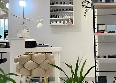 Modern interior of The Muse Salon, Manama, Muḥāfaẓat al-ʿĀṣimah, BH showcasing sleek design and beauty products.