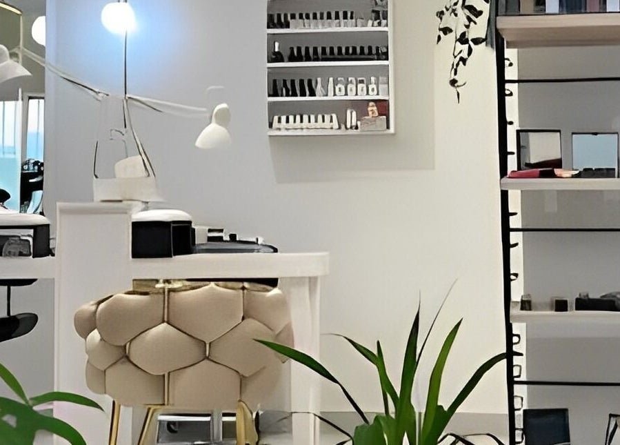 Modern interior of The Muse Salon, Manama, Muḥāfaẓat al-ʿĀṣimah, BH showcasing sleek design and beauty products.