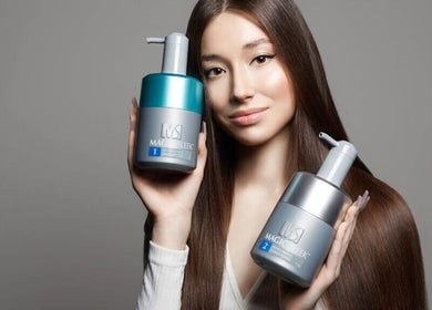 A woman showcasing hair products at HAIIER SALON - Freelance, New York, New York, US.