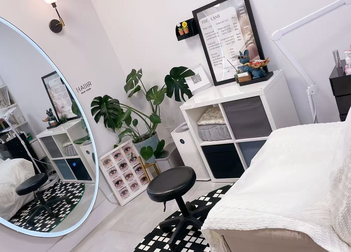 Modern beauty treatment room at New York - Freelance, New York, US with elegant decor and lush greenery.