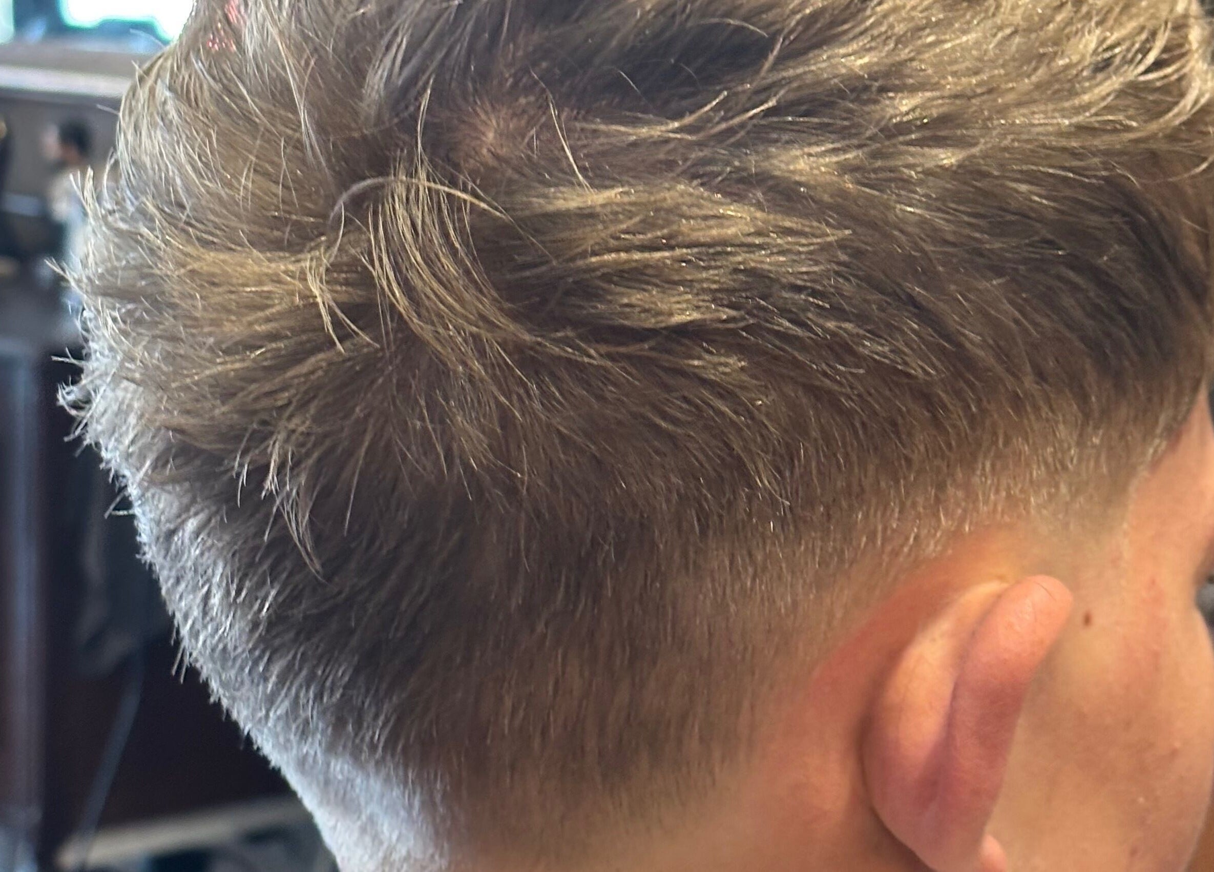 Close-up of modern fade haircut at Kuif & Baard Barbershop, Pretoria, Gauteng, ZA.