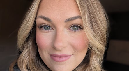 Close-up of a smiling woman at Sarah at Revel Rose in Bowmanville, Ontario, CA, showcasing professional makeup.