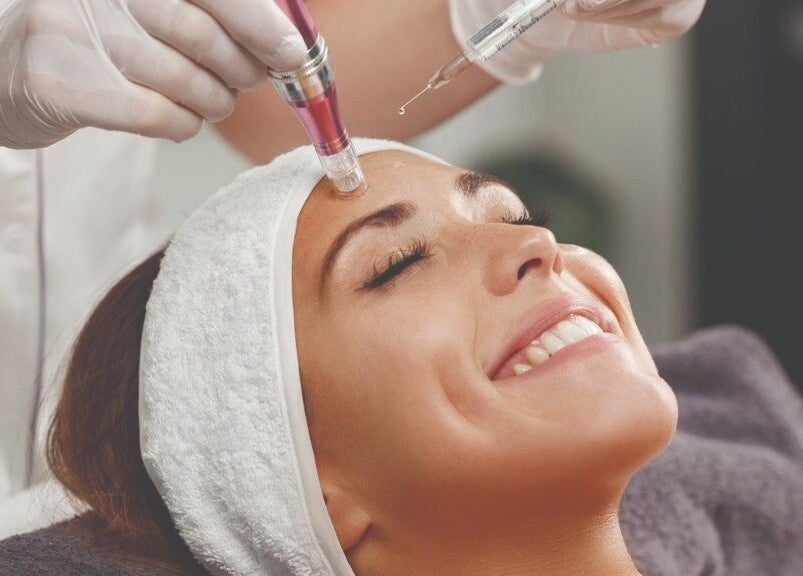 Woman receiving a facial treatment at DermaLook Aesthetics in Toronto, Ontario, CA.