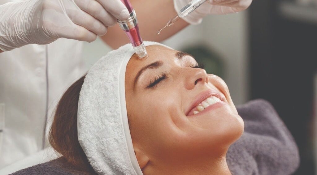 Woman receiving a facial treatment at DermaLook Aesthetics in Toronto, Ontario, CA.