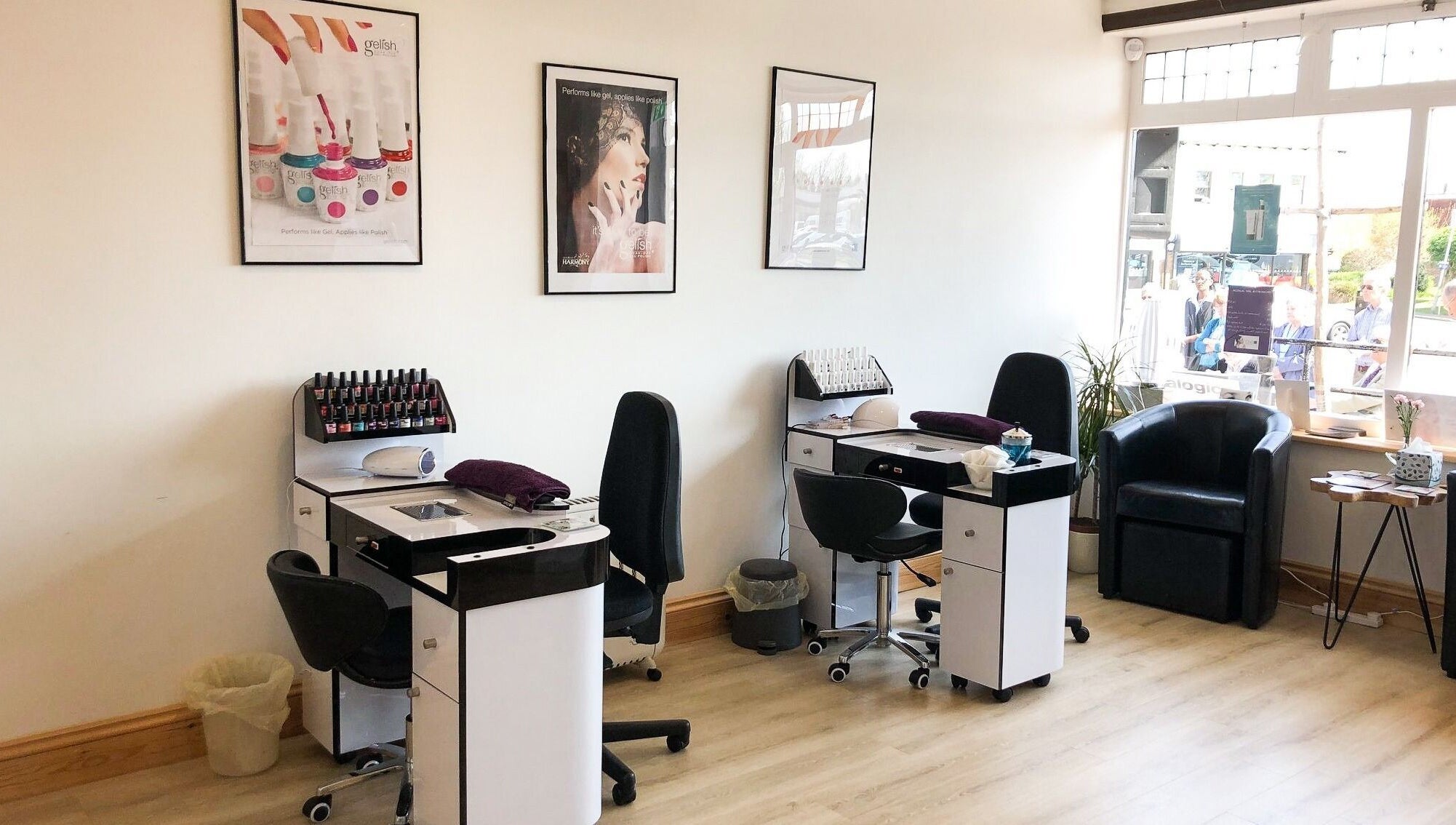 Nail care stations at Barnham Health and Beauty in Barnham, England, GB, featuring modern chairs and nail polish.