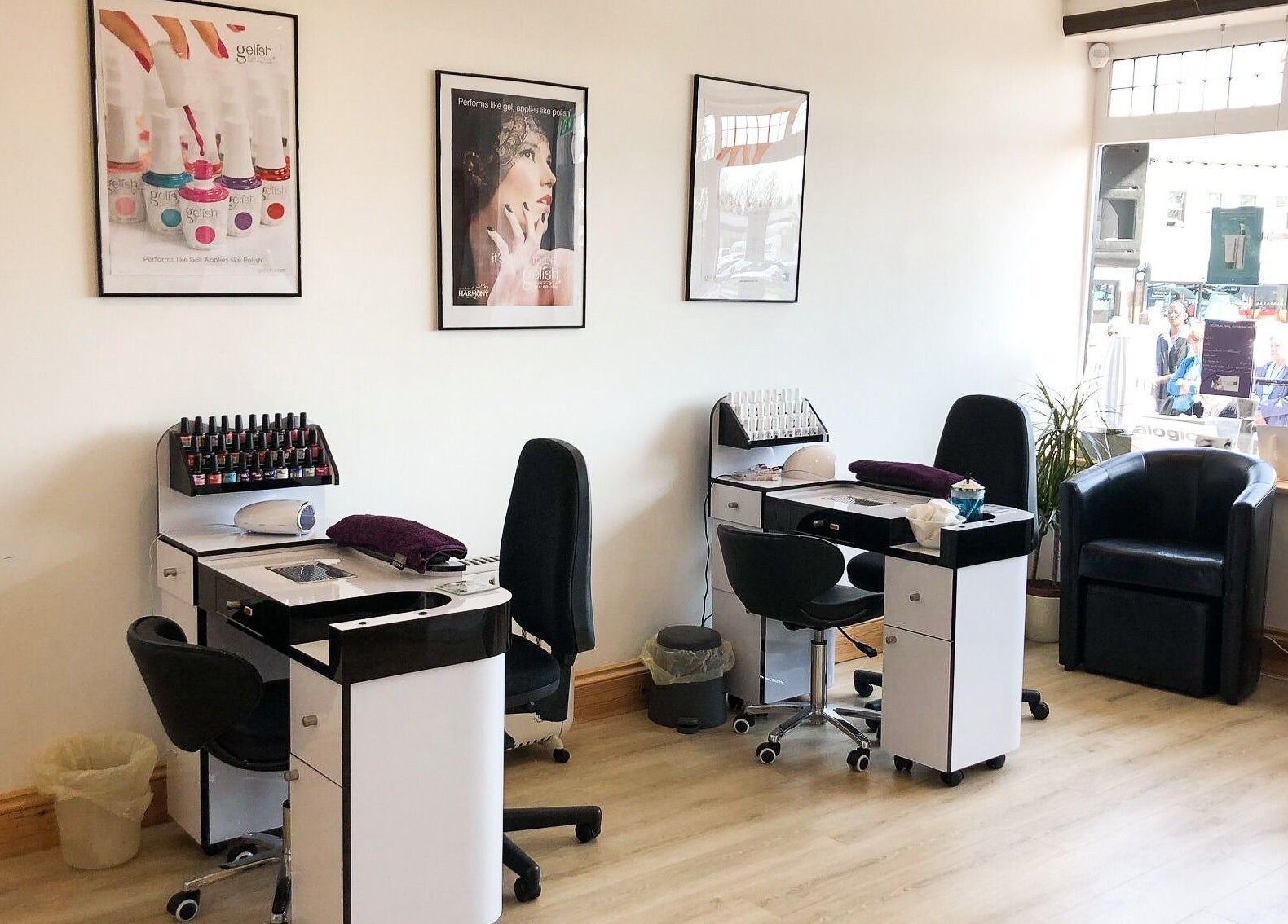 Nail care stations at Barnham Health and Beauty in Barnham, England, GB, featuring modern chairs and nail polish.