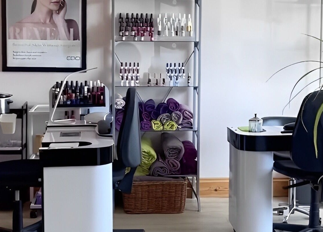 Nail salon setup at Barnham Health and Beauty, Barnham, England, GB, featuring chairs, nail polish, and towels.